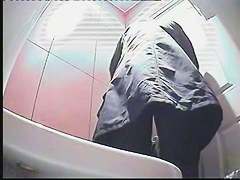 A milf pissing in the toilent to a voyeur spy cam